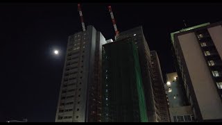 Walk around the building under construction in the moonlight