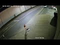 Surveillance video shows group of people emerging from sewer through manhole cover