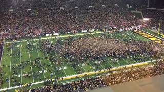 Iowa fans rush the field after beating Ohio State, 55-24