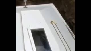 The creepy moment that a corpse appears to wave from inside a coffin