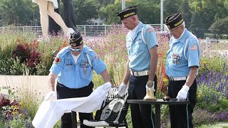 American Legion Post 1 members place Missing Man table during POW/MIA Recognition Day ceremony