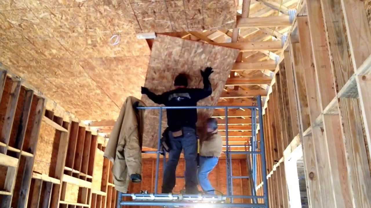 Hanging OSB Plywood On A High Ceiling A Scaffold And Two People. - YouTube