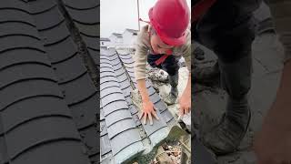 Workers are installing Chinese style tiles