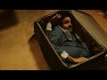 The Man Trapped in a Suitcase, Spewing Gold in Pain.