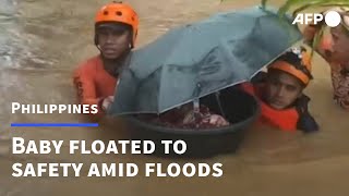 Baby floated to safety in tub amid floods in Philippines | AFP