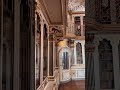 a white and gold library in christiansborg castle