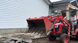 Tearing out concrete with Kubota backhoe b2601