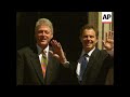 uk clinton arrives