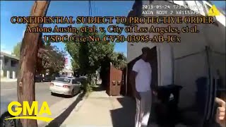 Body camera footage released of Black man arrested while taking out trash l GMA