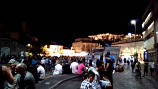 Athens - A lively square in the evening while the Acropolis looks down on the people