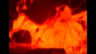 Close up of ocean entry lava bubble bursts from Kilauea's Puu Oo eruption