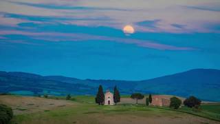 Time-Lapse Video of Full Moon Rising over Chapel of Vitaleta, Tuscany.