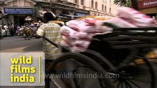 Human-pulled rickshaw on streets of Kolkata