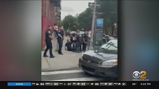 Video shows crowd throwing bottles at cops in the Bronx