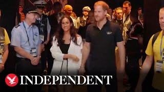 Meghan and Harry hold hands, joining crowds at Invictus Games