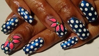 Blue Polka Dot Nails Design With Neon Pink Flower