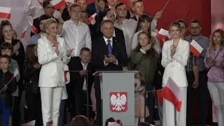 Polish president ahead by tiny margin in run-off: exit poll | AFP