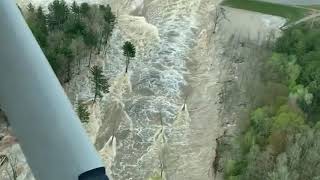 Pilot captures rushing water flowing through failed Edenville Dam