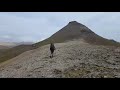 hiking a windy pass in the east fjords of iceland