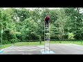 man does outstanding balancing trick by climbing on top of ladder 1136198 1