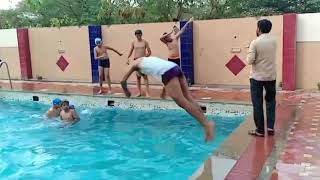 Front flip into a swimming pool in slow motion