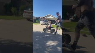 Sissy driving the four wheeler