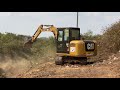 អេស្កាវ៉ាទ័រវៃព្រៃ cat 306e excavator vs wild making road in cambodia