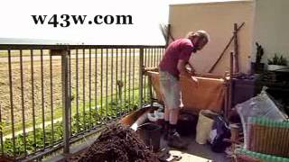 womble gardening turning balcony compost again!.wmv