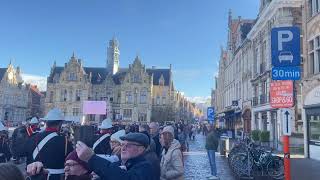 Bands marching through Grote Markt in Ypres on the way to Menin Gate on Remembrance Day 11.11.2023