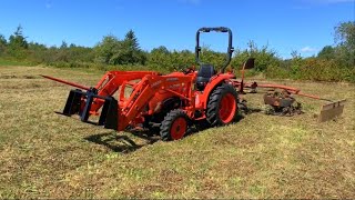 Raking hay with the Kubota L2501 and the Hesston 3700 rake/tedder.