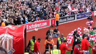 Stoke City and AFC Bournemouth walk out at the Britannia