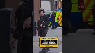 Armed police cordon, on Manchester city centre street