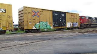 CN 8011 SD70M-2 has the graffiti covered freight cars pulled from Pavilion Siding