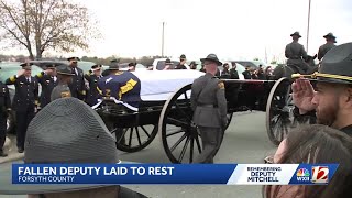 ‘My home’s gone forever’: Family and friends mourn Forsyth Co. Deputy Kaleb Mitchell during funer...
