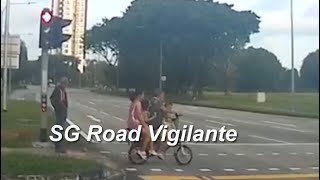 8feb2025 bike rider  with 3 passengers ignoring red light signal riding across the 8 land road