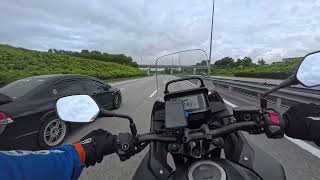 Riding the Honda NX500 on the highway in Malaysia.