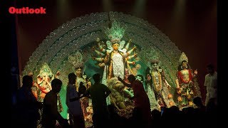 Devotees perform prayer during Durga Puja in Bengal