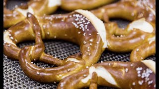 Automated twisting of pretzels