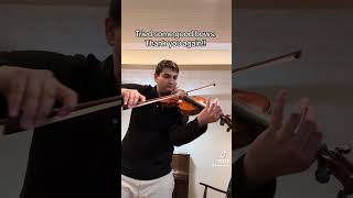 Alex Valor trying some violin bows.