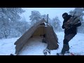 hot tent winter camping in a snow storm wood stove cold weather snowfall