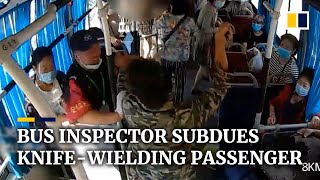 Bus inspector subdues knife-wielding passenger in China