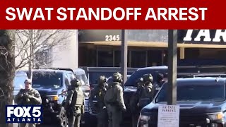 SWAT standoff ends with arrest of man who allegedly shot at police