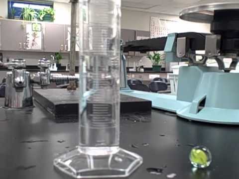How do you find the volume of an irregular stone?