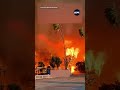 massive wildfires rapidly spread across los angeles california.