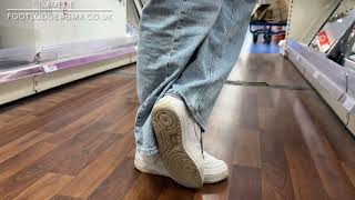 Nike Air Force One and bare feet