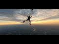 The U.S. Army Parachute Team jumps at Sunset over Washington Monument