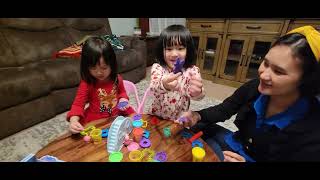 Keziah and Ching ching makes animals with play doh