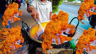 The handsome boy is selling Delicious Shrimp Head fry  which is a very interesting dish