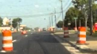 Driver swerves and hits a traffic barrel breaking their mirror off