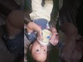 8 month old baby holding a bottle by herself